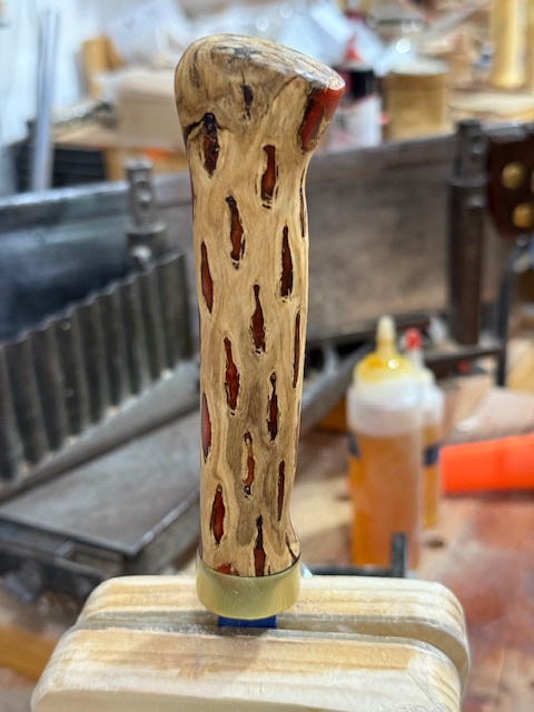 The knife-handle, nearly completely shaped and sanded, with the first coat of finishing oil on