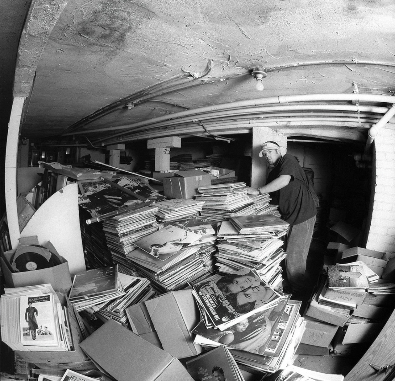 huge pile of records in a basement