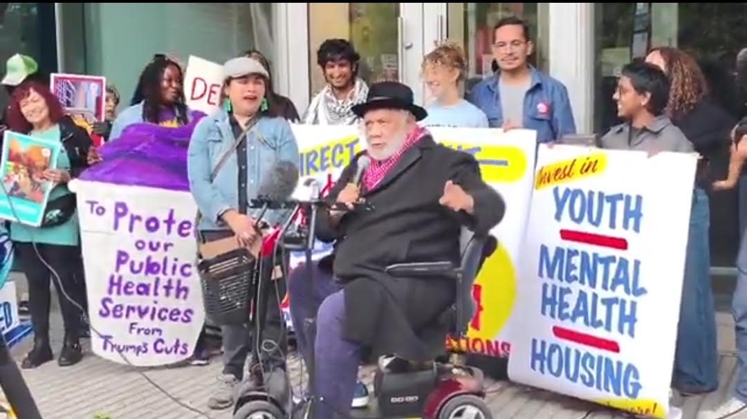 Frank Chapman speaking at funds, not feds protest.