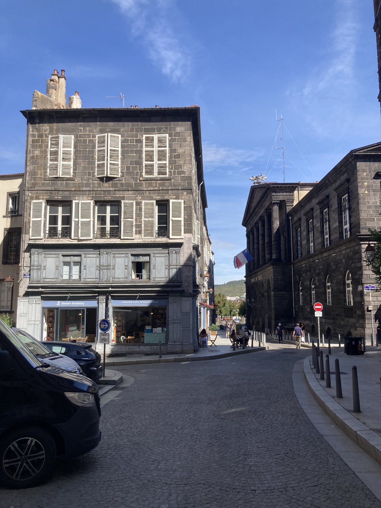 Image of an 19th century building in France. The ground floor is taken up with a store, called Emma's Bookshop