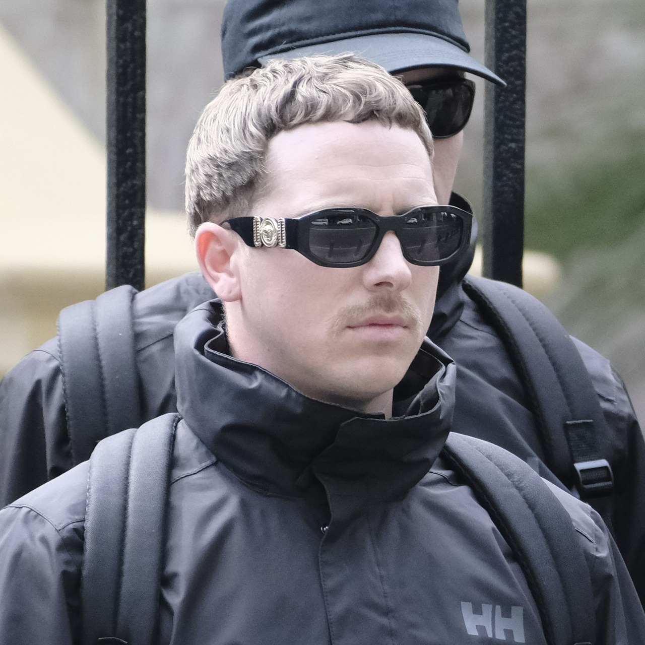 Another angle showing his rounder face and extensive frown lines