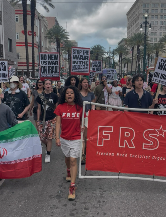 Protesters march down Canal Street in downtown New Orleans.