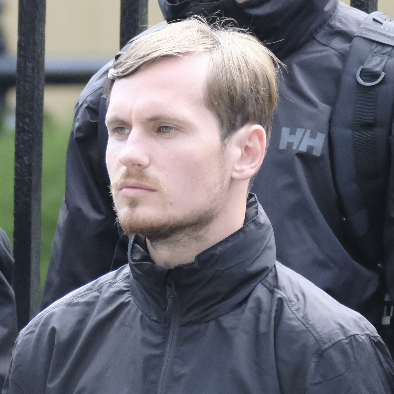 The same man from another angle, showing a receding hairline