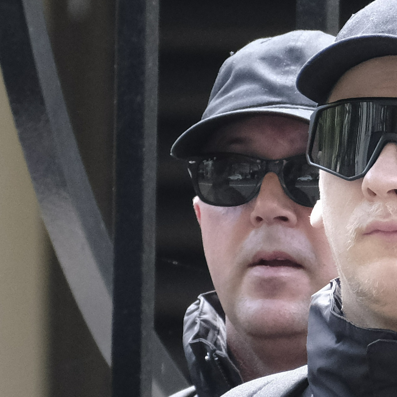 Older white man gaping like a fish in hat and sunnies