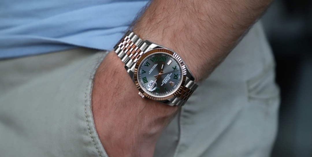 Photo by [Millenary Watches](https://unsplash.com/@millenarywatches) on [Unsplash](https://unsplash.com/photos/a-close-up-of-a-person-wearing-a-watch-WSKuvpbnN0E)