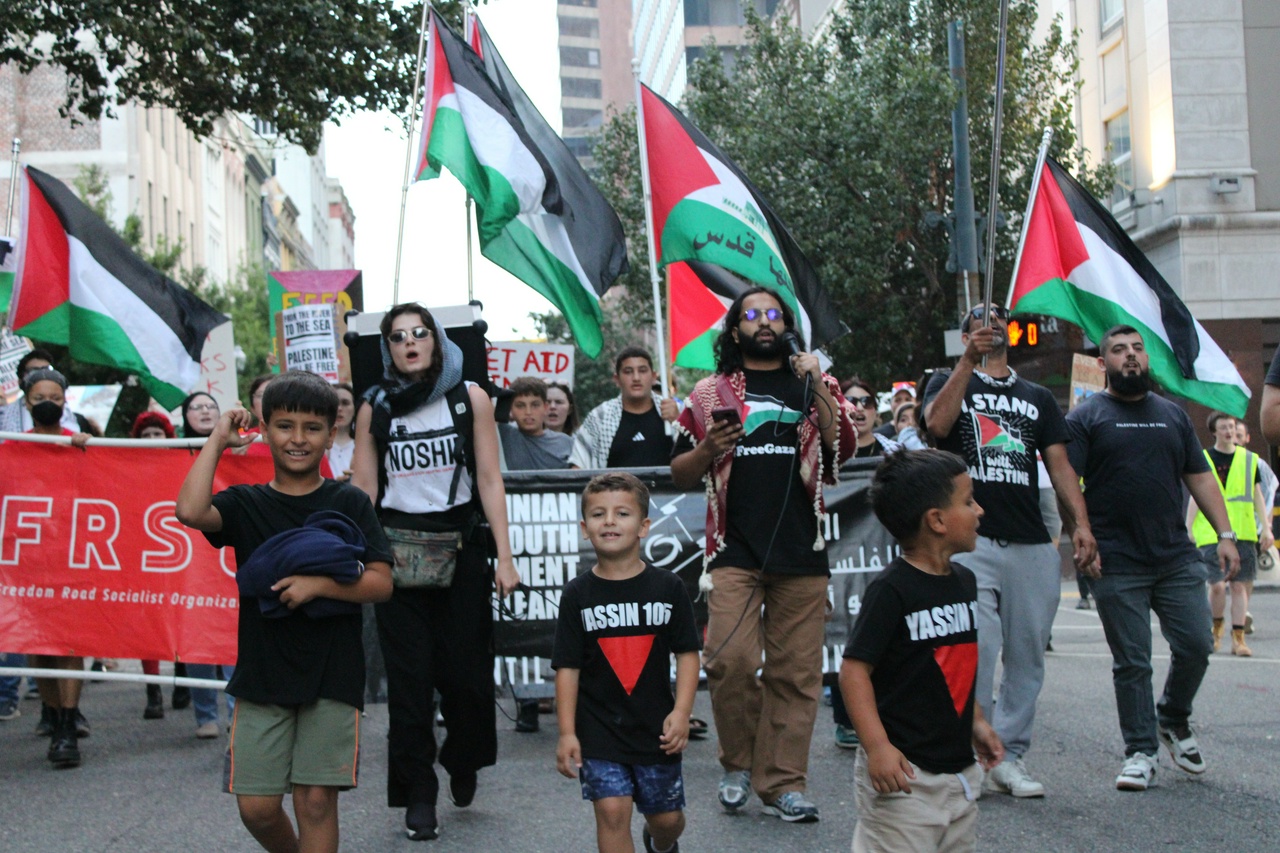 NOSHIP activists lead chants alongside Palestinian youth in downtown New Orleans.