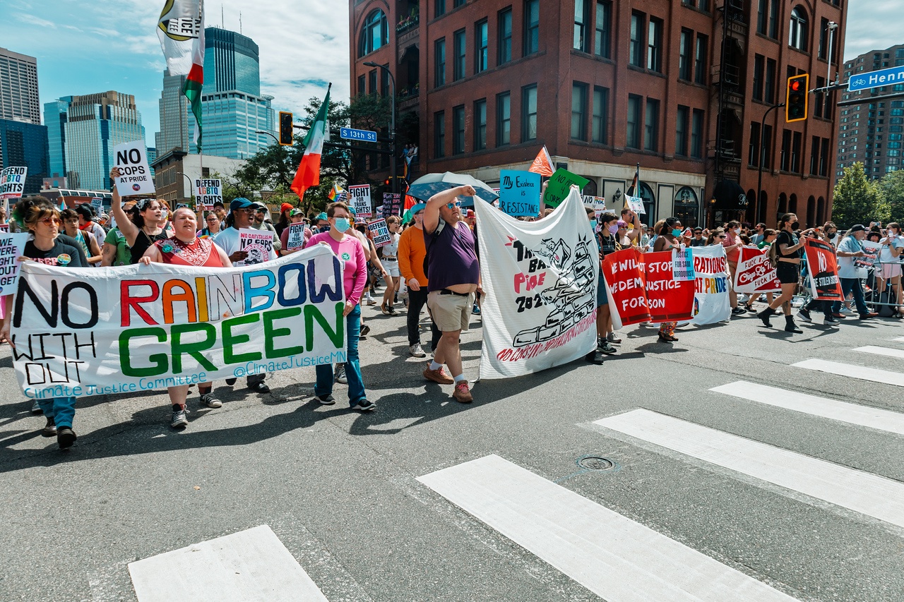 A pride march with banners 