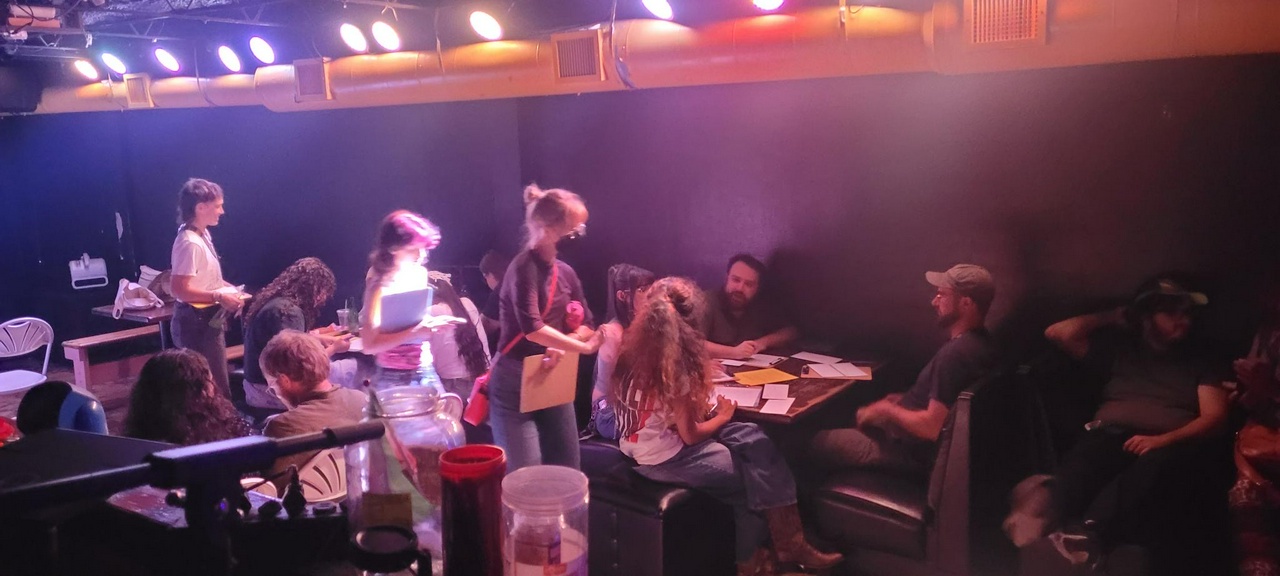 Jacksonville activists write letters to U.S. senators, ‘Free President Maduro and First Lady Celia Flores.’ | Fight Back! News A room full of people at tables writing letters.