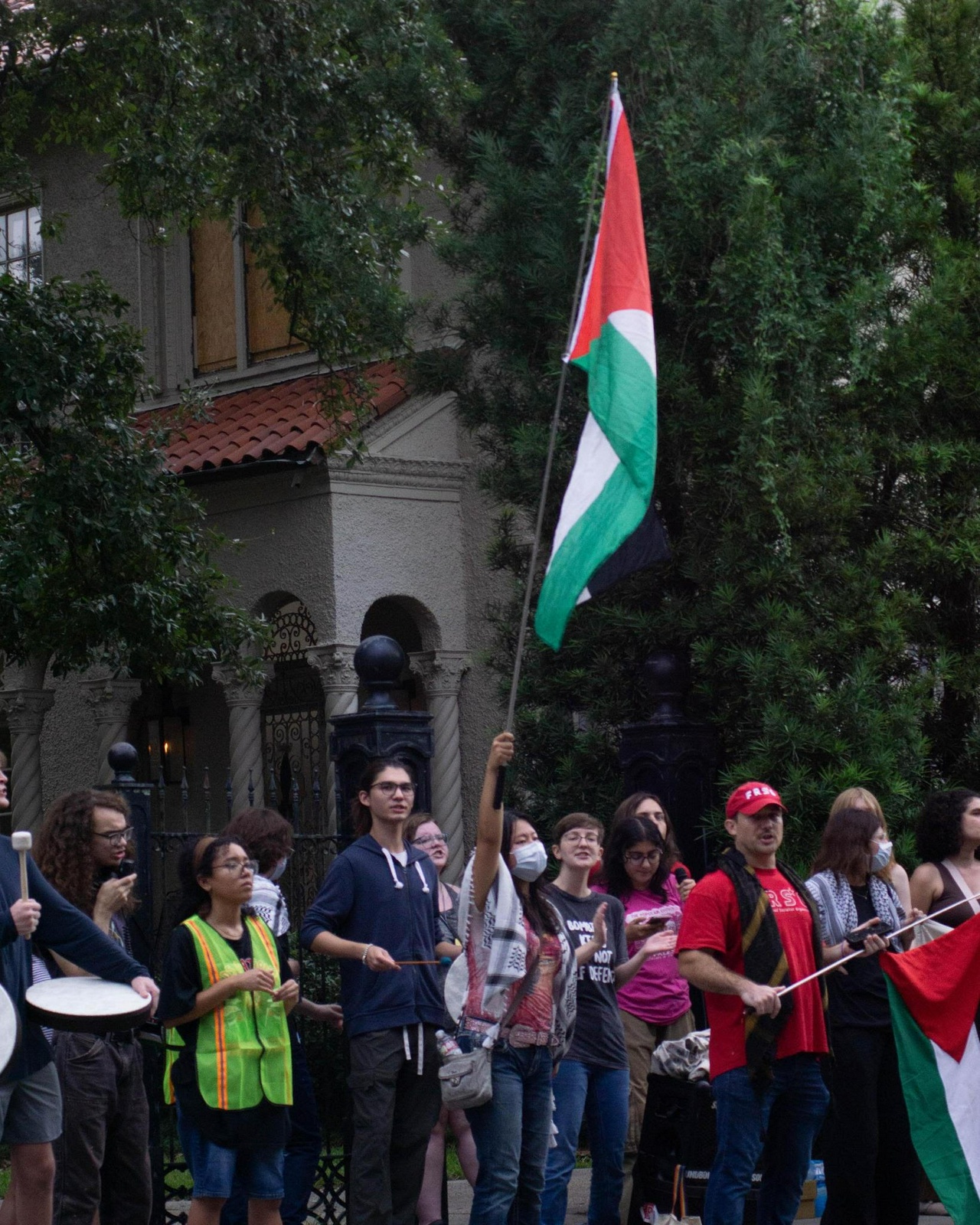 Protesters chant and bang drums on Freret Street near Tulane's campus to disrupt an IDF talk at Tulane Chabad.