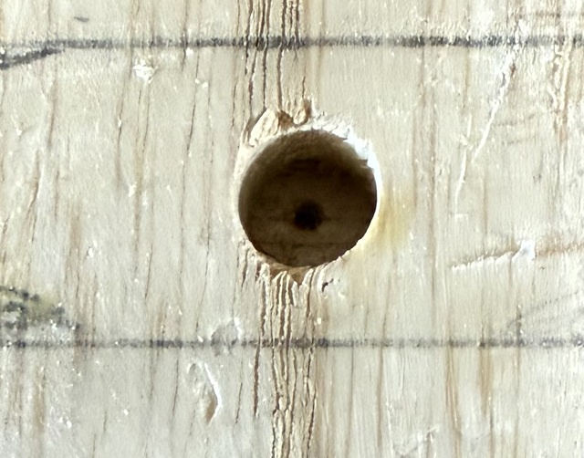 A view into the hole in the handle to where the mark is on the cane shaft tenon