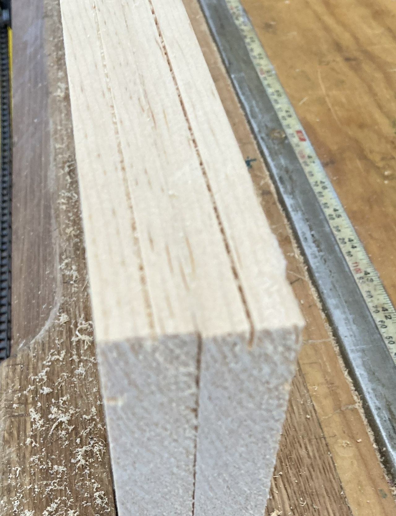 Small sawn marks down the middle of two 3/4 inch wide boards