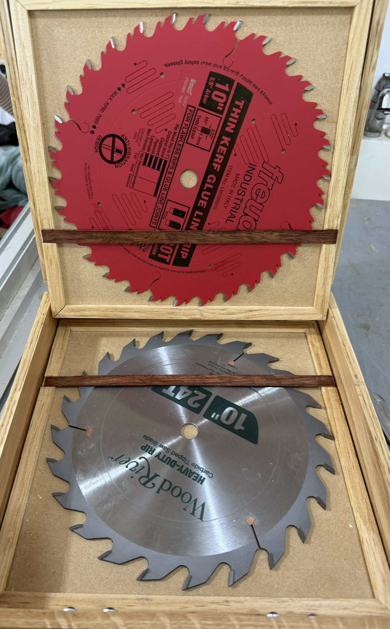 Open table saw blade case, showing two blades stored