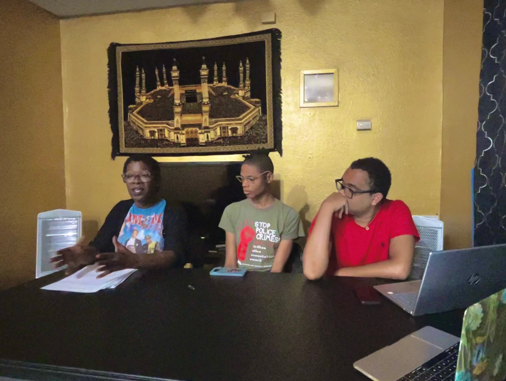 Shanta Scott, left, speaks on the details of her son's case. To her right sit Toni Jones and Anthony Franklin of the New Orleans Alliance Against Racist and Political Repression.