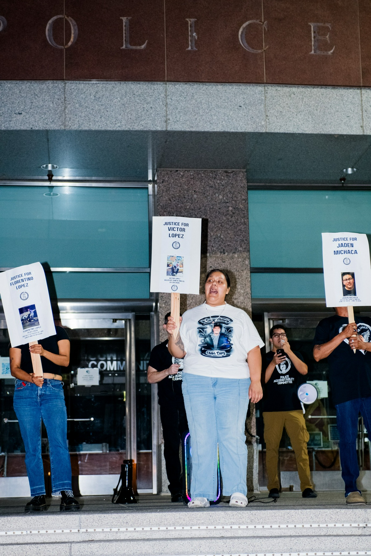 A group of protesters holding signs.