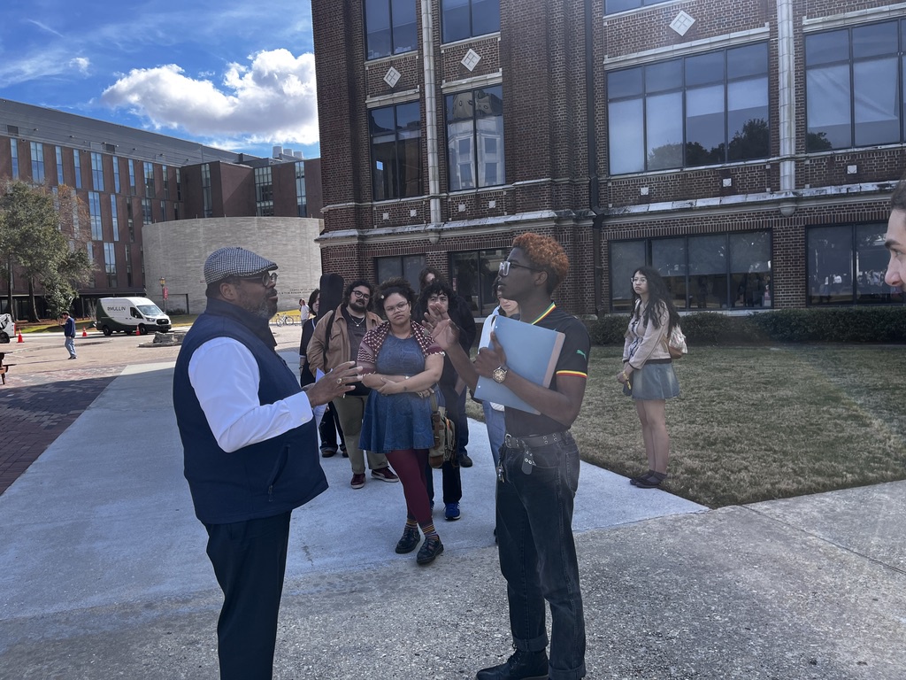 Students confront Loyola New Orleans University President Xavier Cole on a busy campus quad to press the issue of immigrant sanctuary policies.