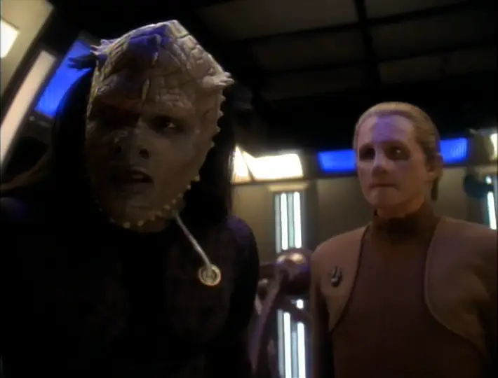 Bumper Robinson in Jem'Hadar makeup playing the unnamed Jem'Hadar teenager in the DS9 episode The Abandoned. He looks at something off screen while Odo watches him.