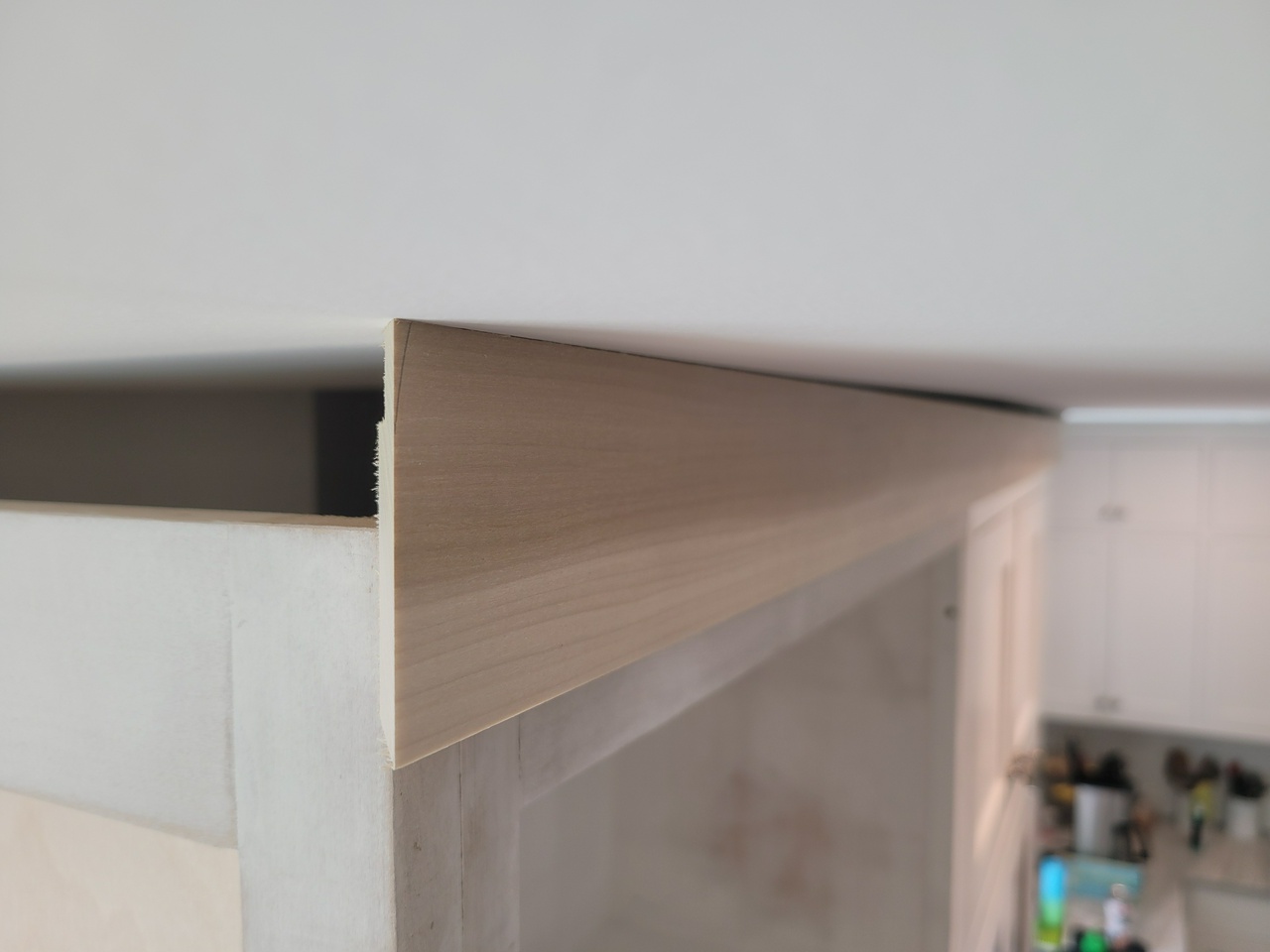 left of facia touching ceiling (low point)