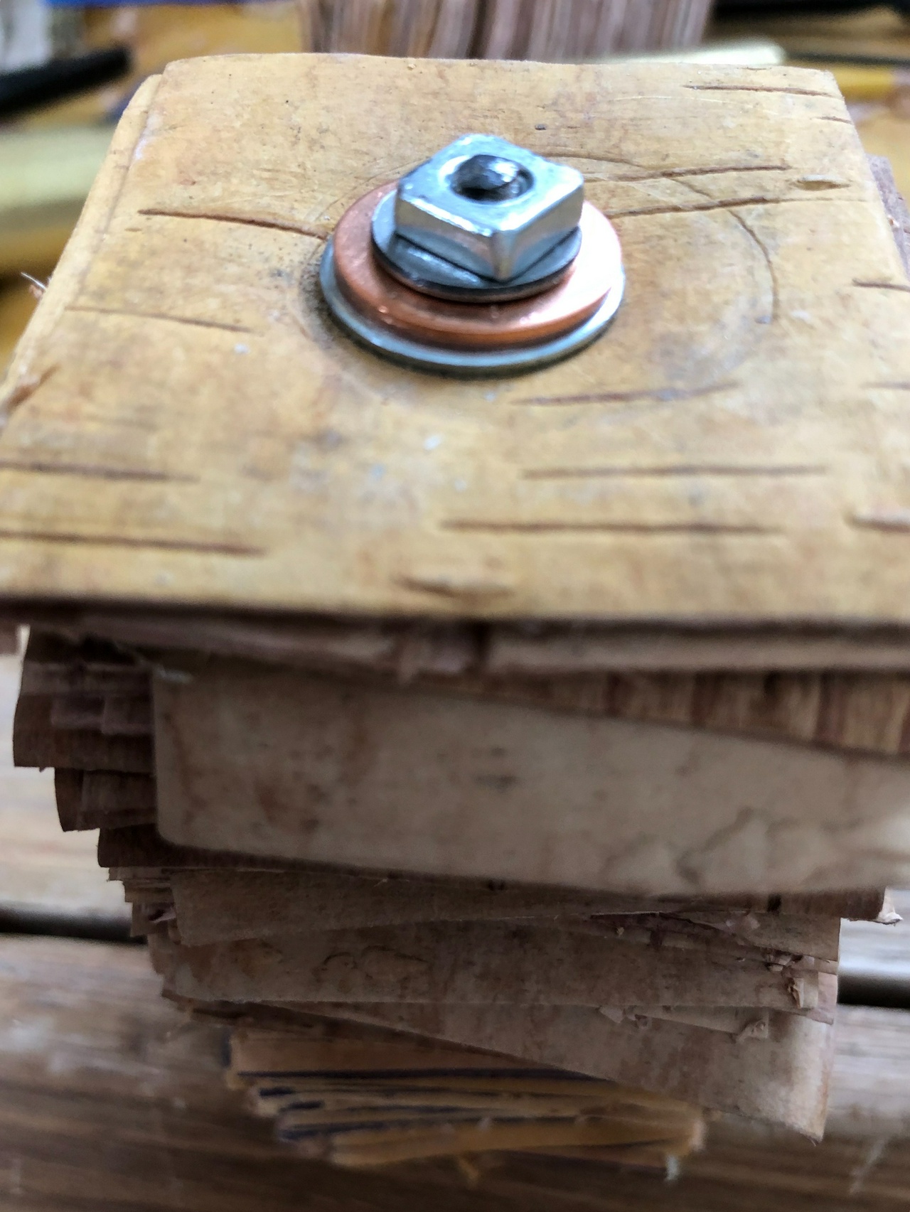 Pommel of knife, showing washers and nut on the tang of the knife blank