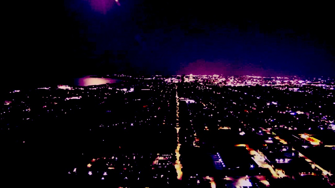 A city skyline, with purple, blue and gold masking used for highlights. A city skyline, with purple, blue and gold masking used for highlights.