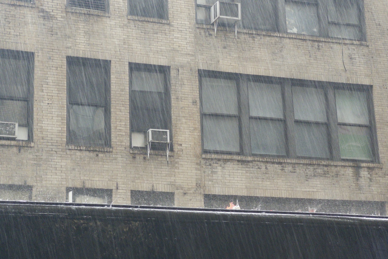 Rain on 32nd street off 5th, truck and windows, 32nd street off 5th, afternoon 6/22/26