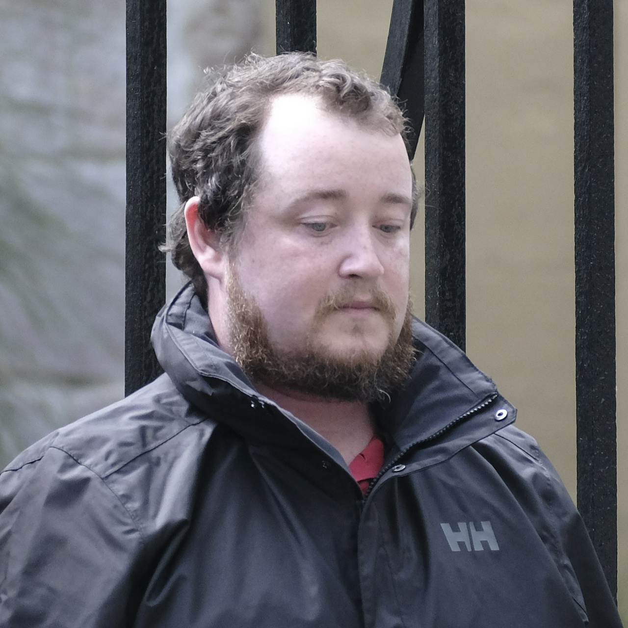 The same guy looking dejectedly at the ground. His freckles are visible in this one.