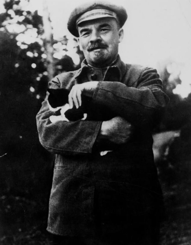 V.I. Lenin holding a cat. 