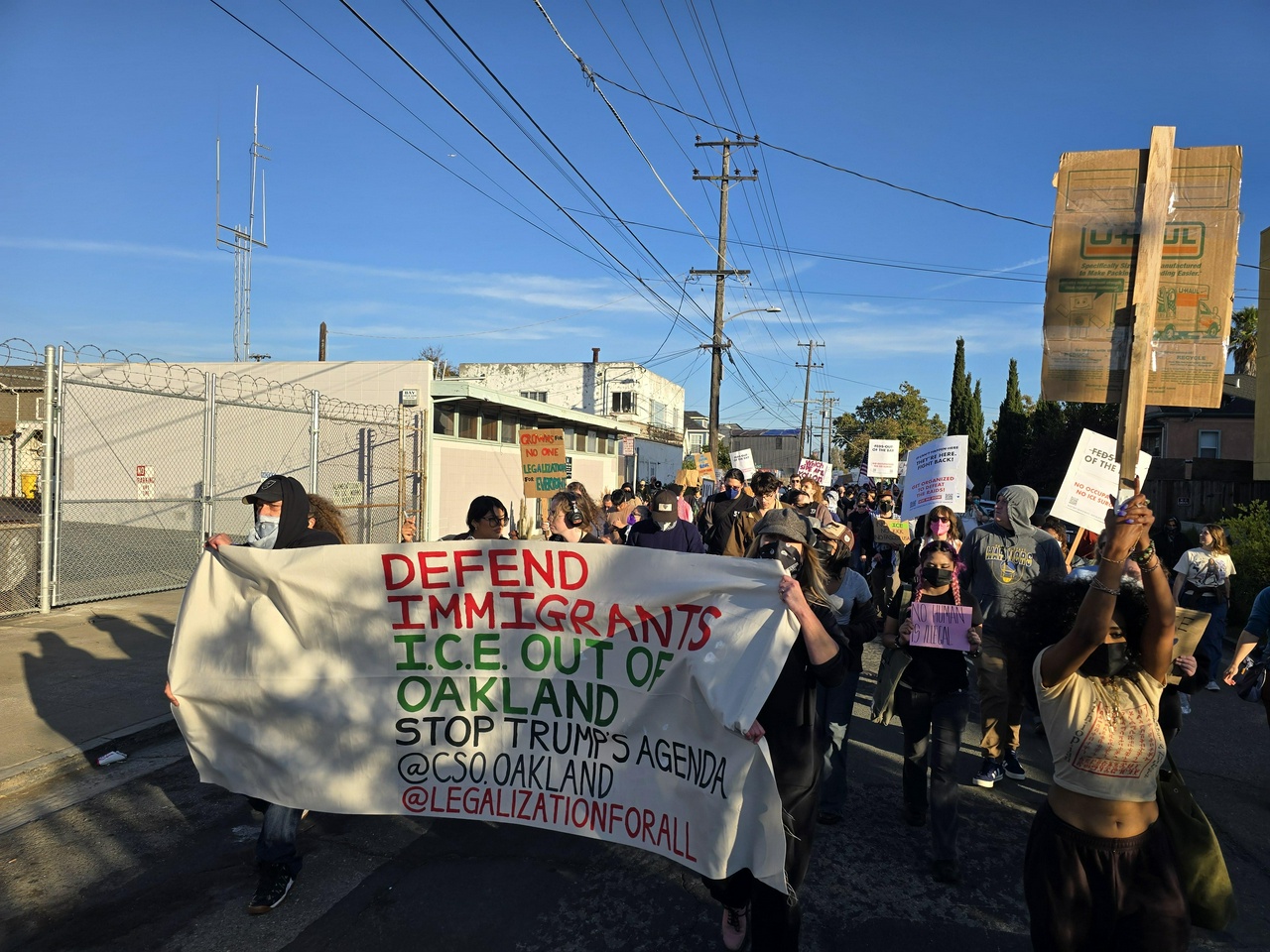 Protesters set out down 35th Avenue on their way to the entrance of Coast Guard Island, where the Coast Guard is assisting a large Customs and Border Patrol operation.