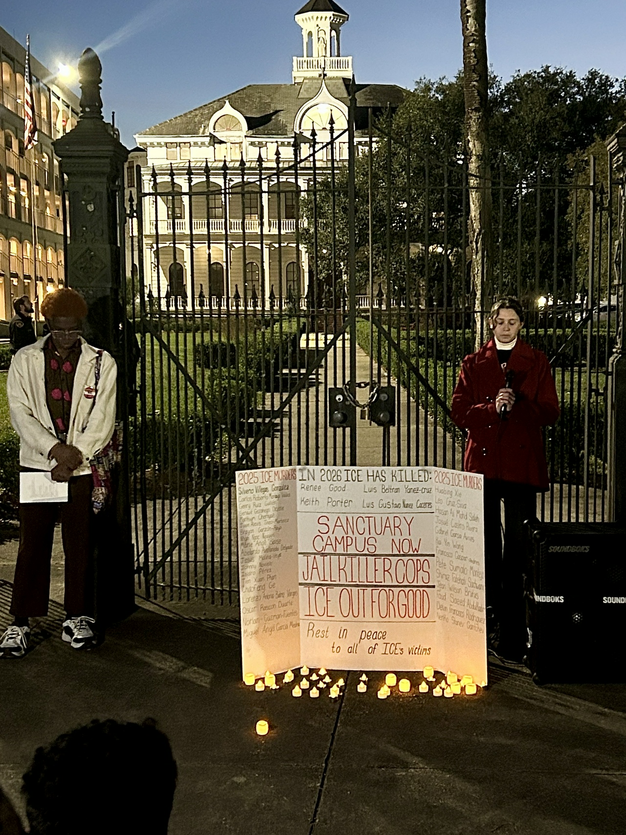 Loyola University New Orleans students stand in front of the law school honoring those who have been killed by ICE agents and detentions.