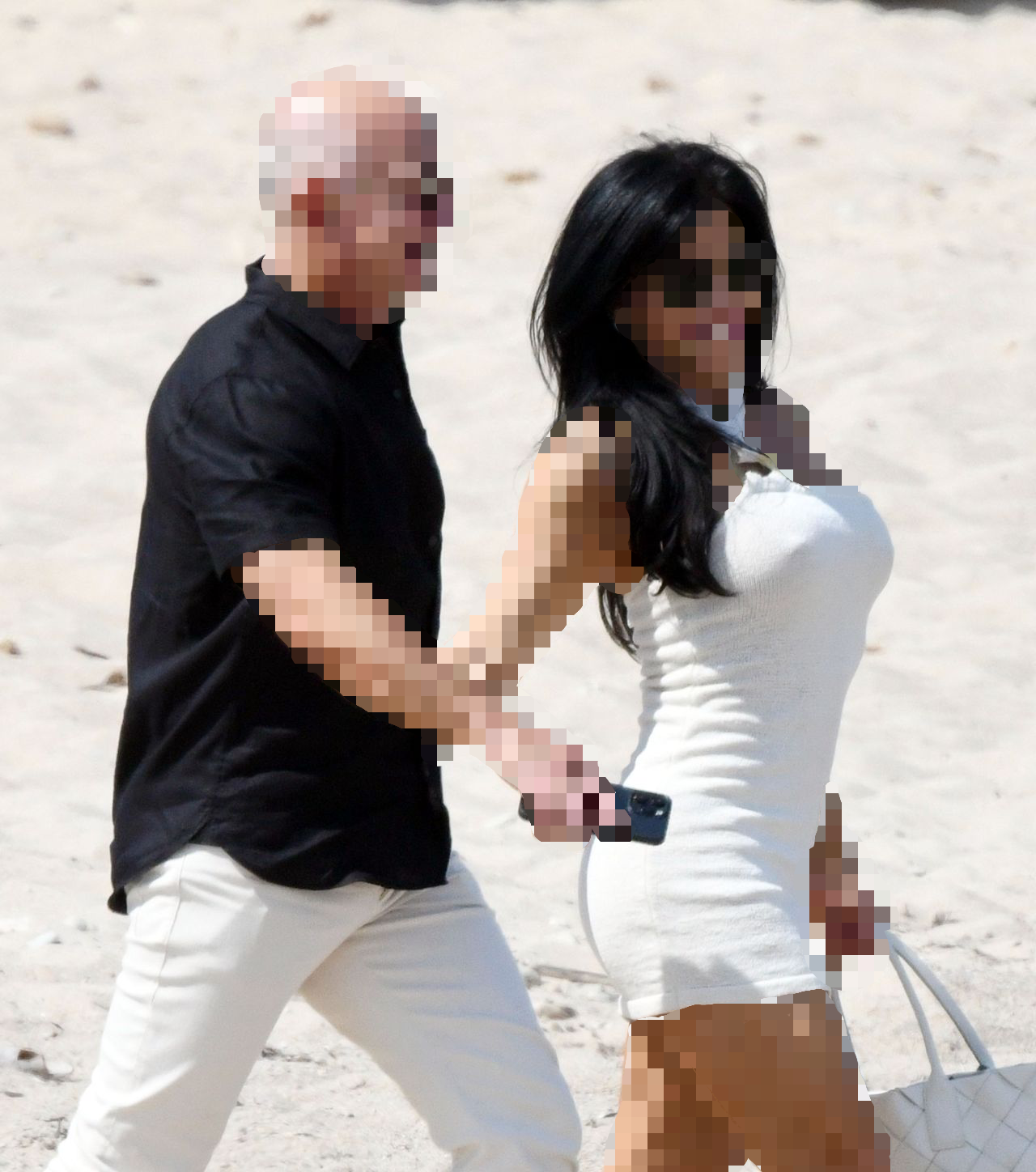 an unidentified man on the beach with the alleged love of his life