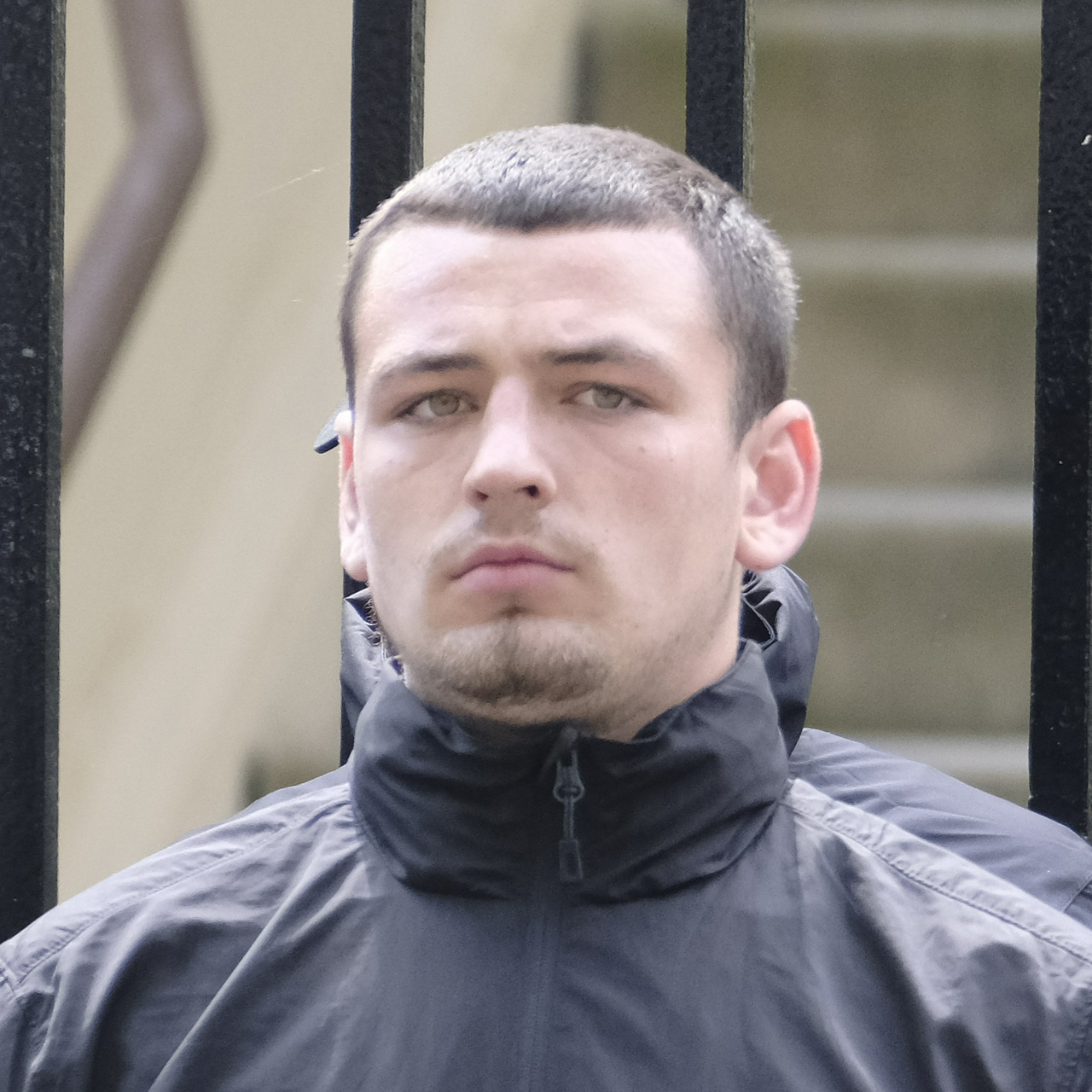 The same man from another angle, showing a very square head and big ears