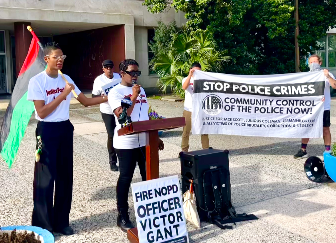 Shanta Scott speaks to the press in front of City Hall.