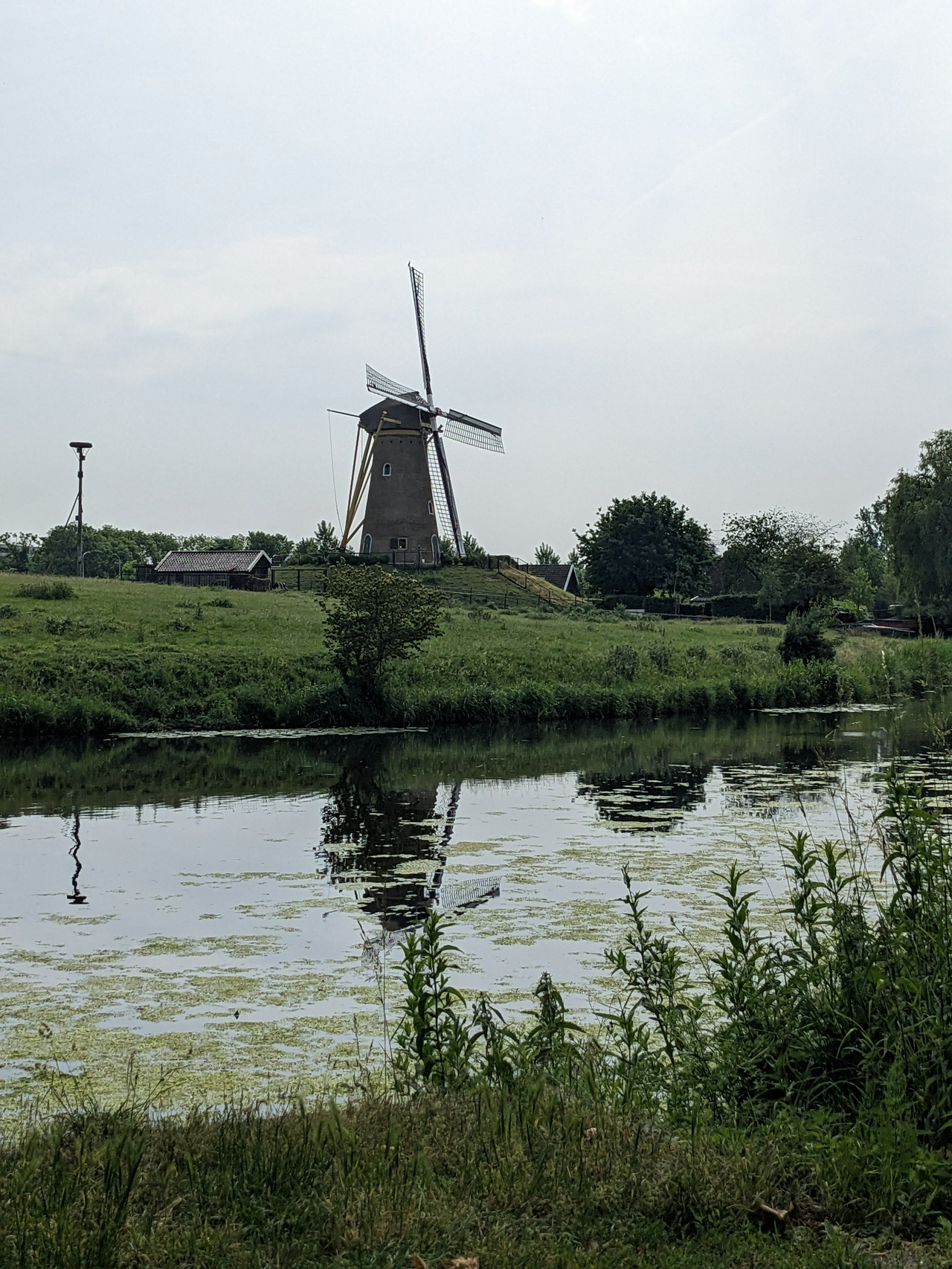 Windfill and its distorted reflection.
