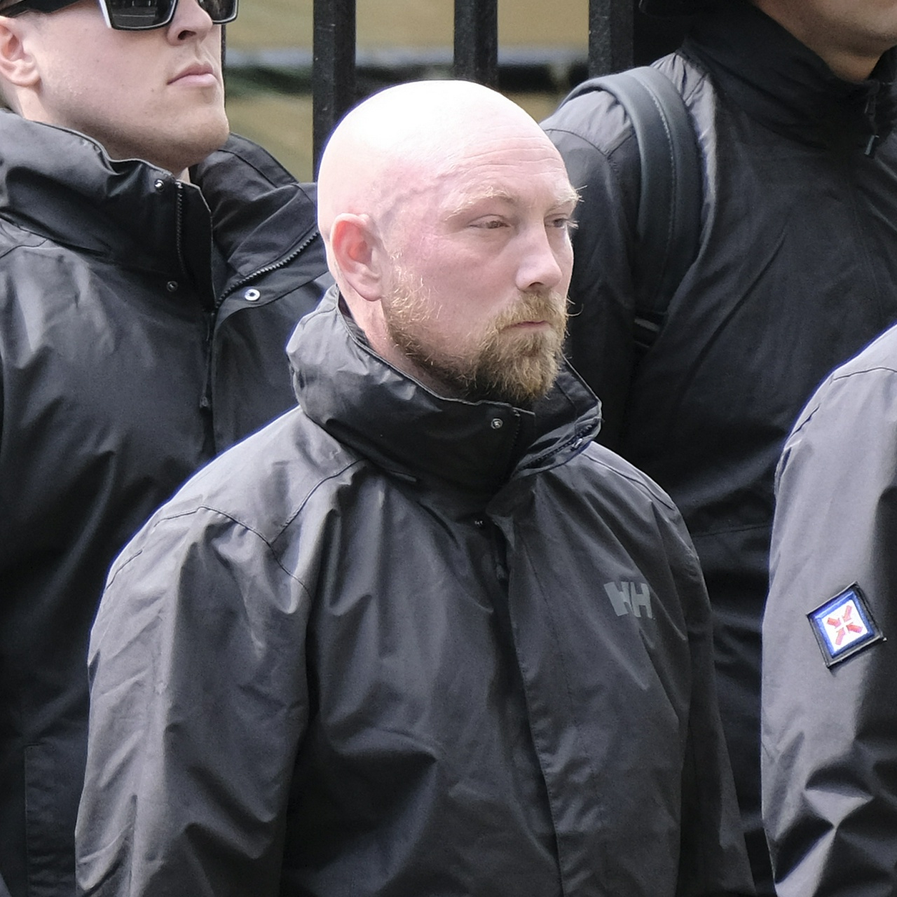 The same man from the side, showing a bulging temple vein