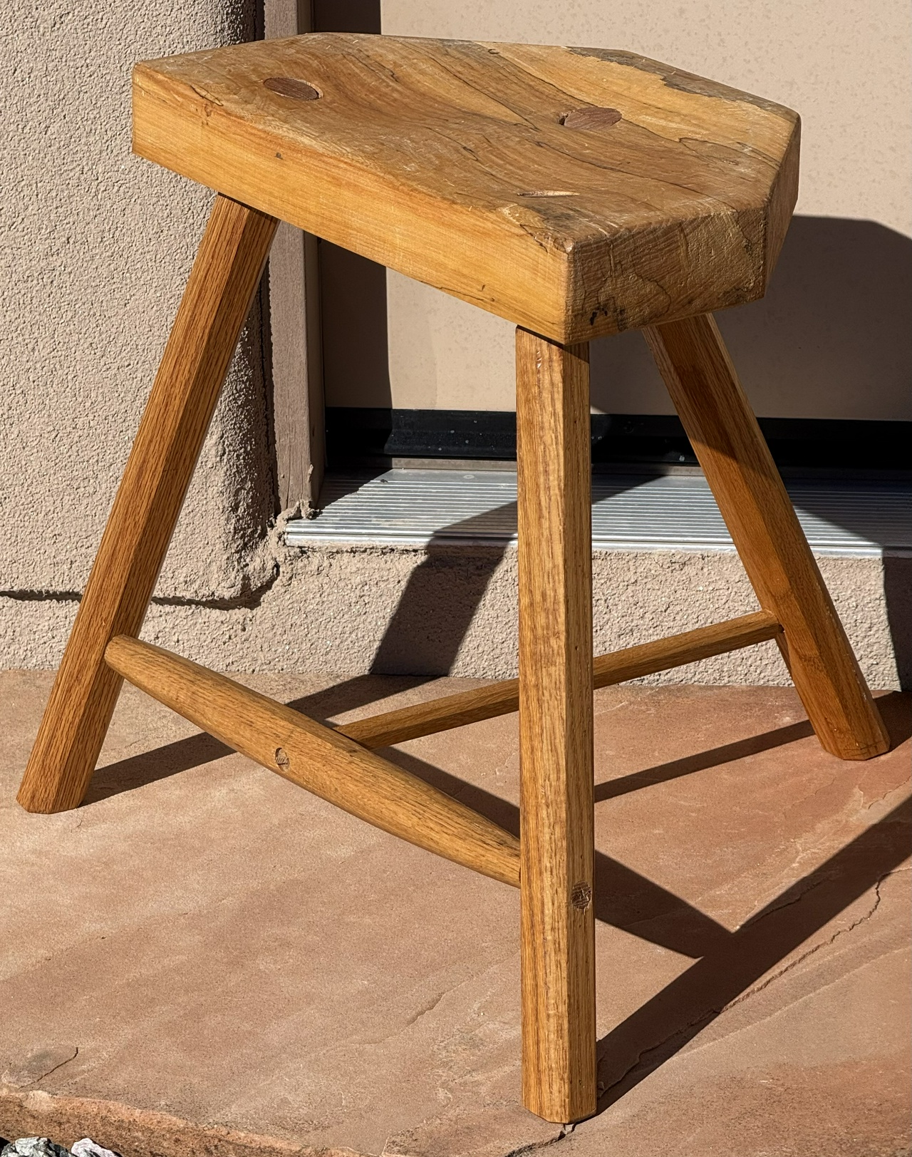 New, shorter stool, seen in front of my shop door in New Mexico sunshine