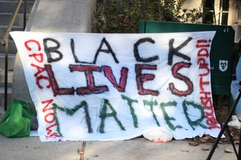 Student activists leave banner at Tulane university's front steps.