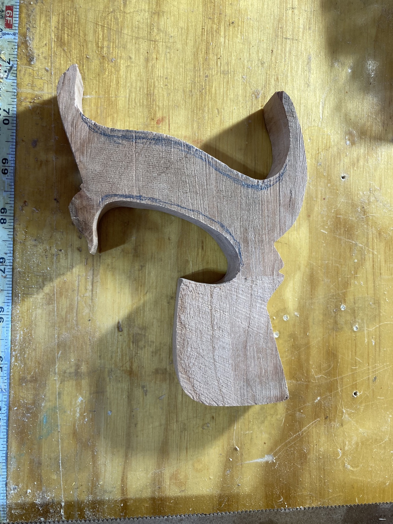 Rough-cut saw handle with the layout lines still visible