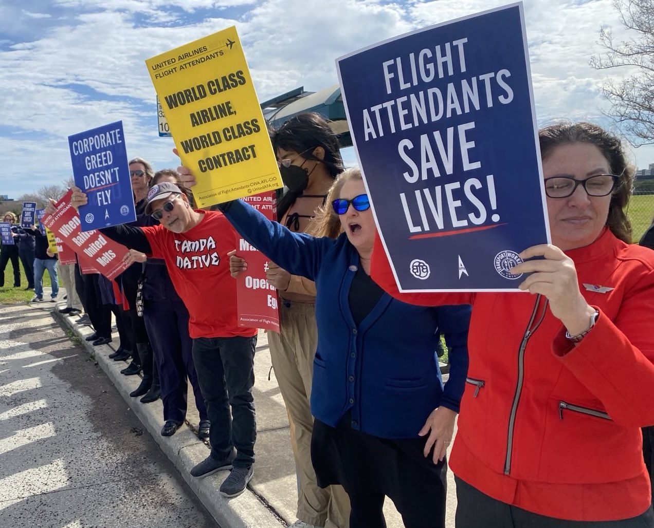 United flight attendants picket for a decent contract at Tampa International Airport.