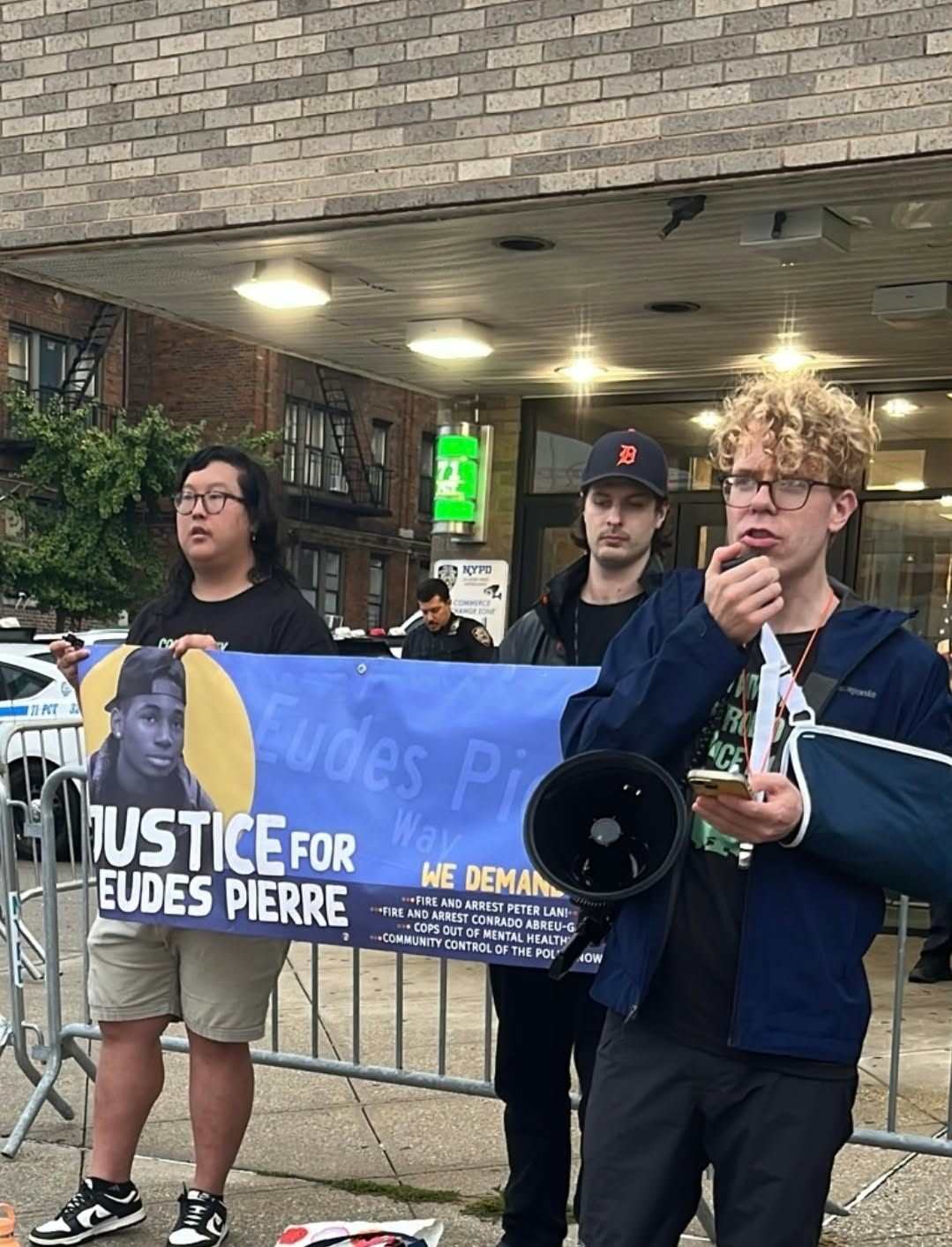 New York City protest demands justice for Eudes Pierre. | Fight Back! News A group of protesters holding a banner.