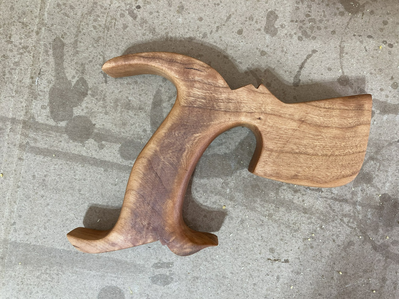 Saw handle more shaped, with a coat of oil on it, right view