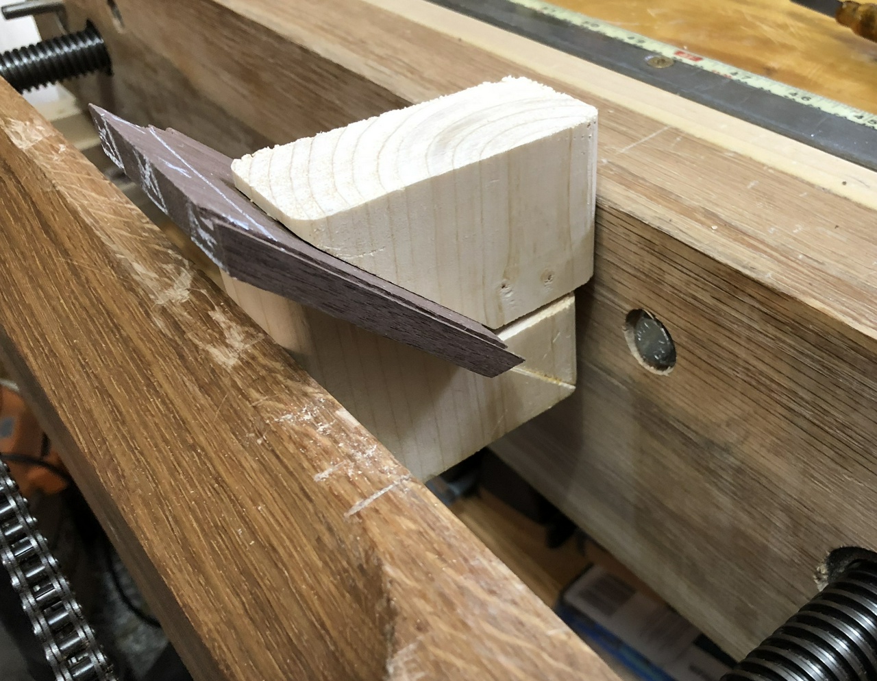 Cutting the pins with the walnut held in the 45 degree jig so I could be sawing level