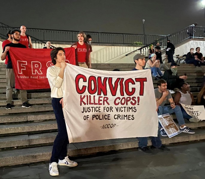 Students United activists carry banner at protest for Tyre Nichols.