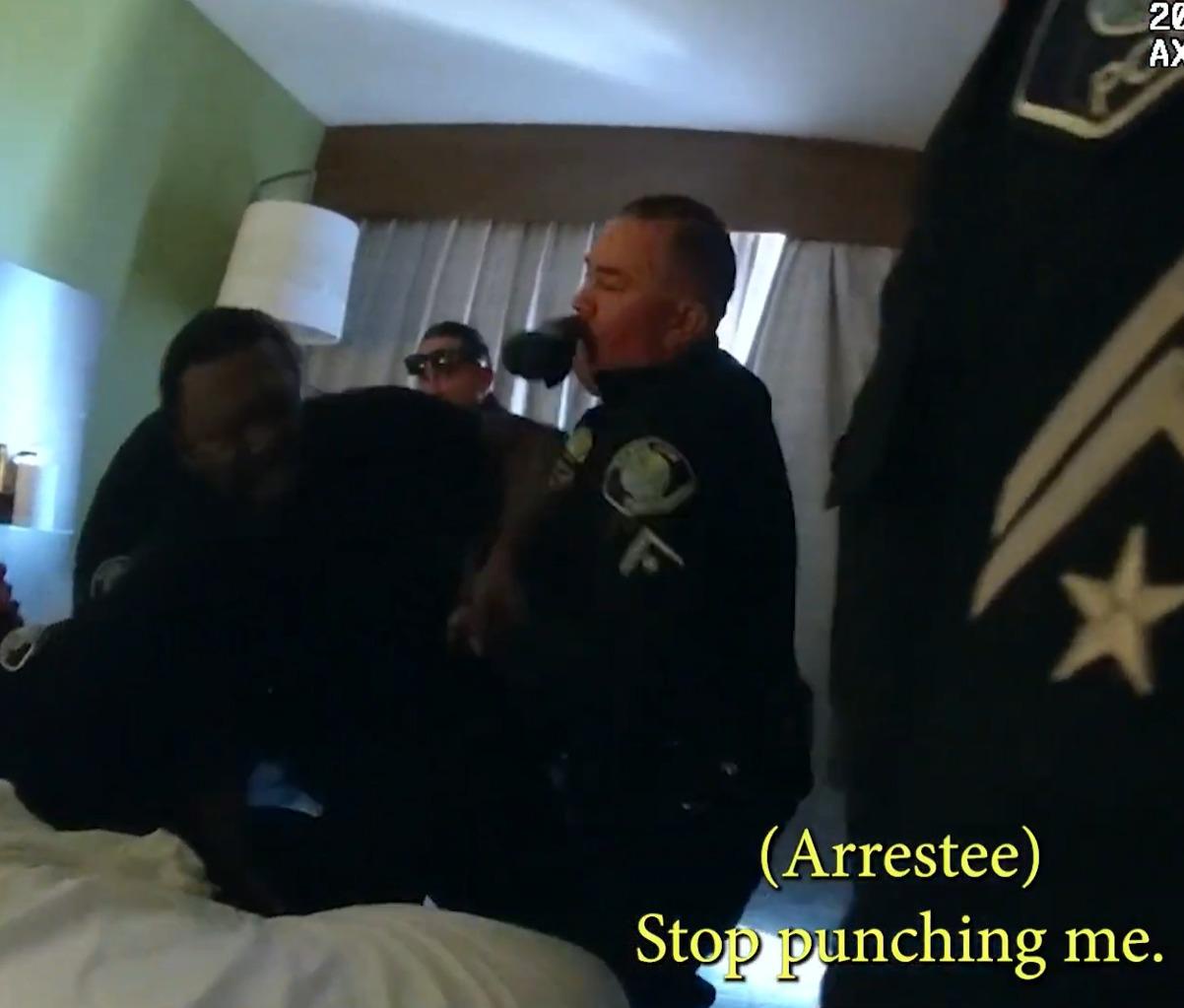 Santa Ana Police Department Officer Frank Corpus punches Freddie Washington in the head. Santa Ana Police Department Officer Frank Corpus punches Freddie Washington in the head.