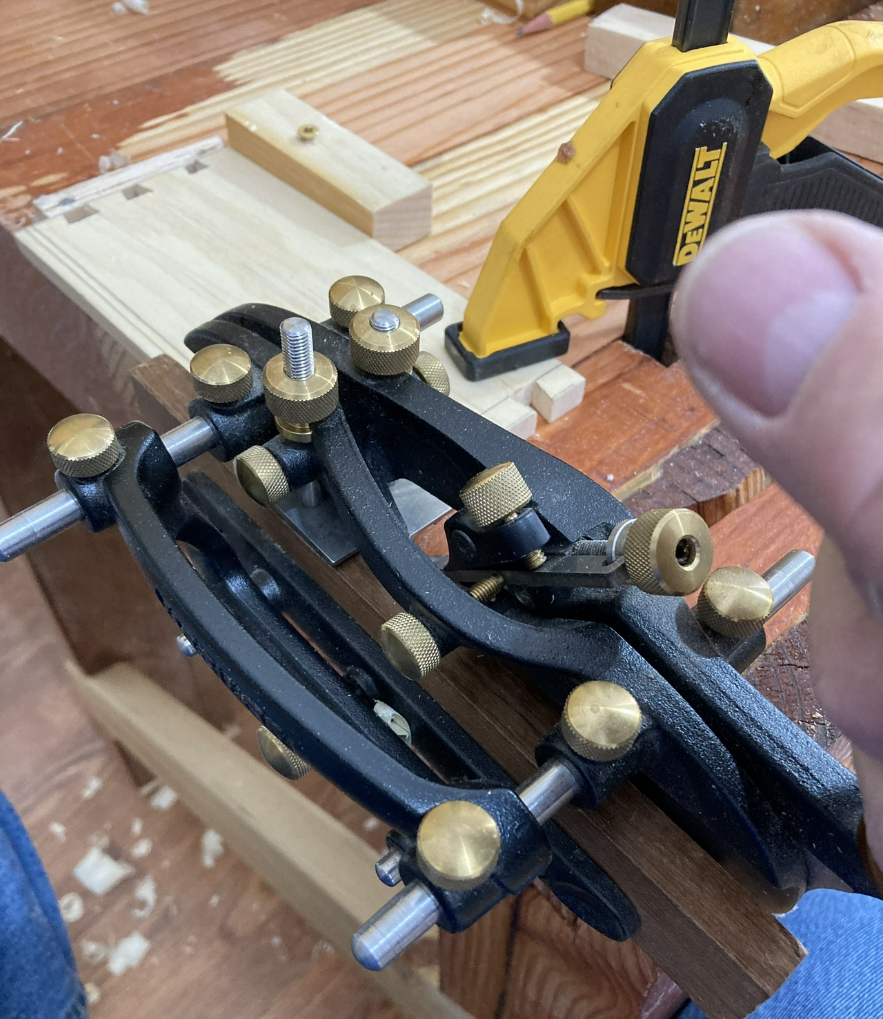 A combination plane, planing a groove in a drawer side