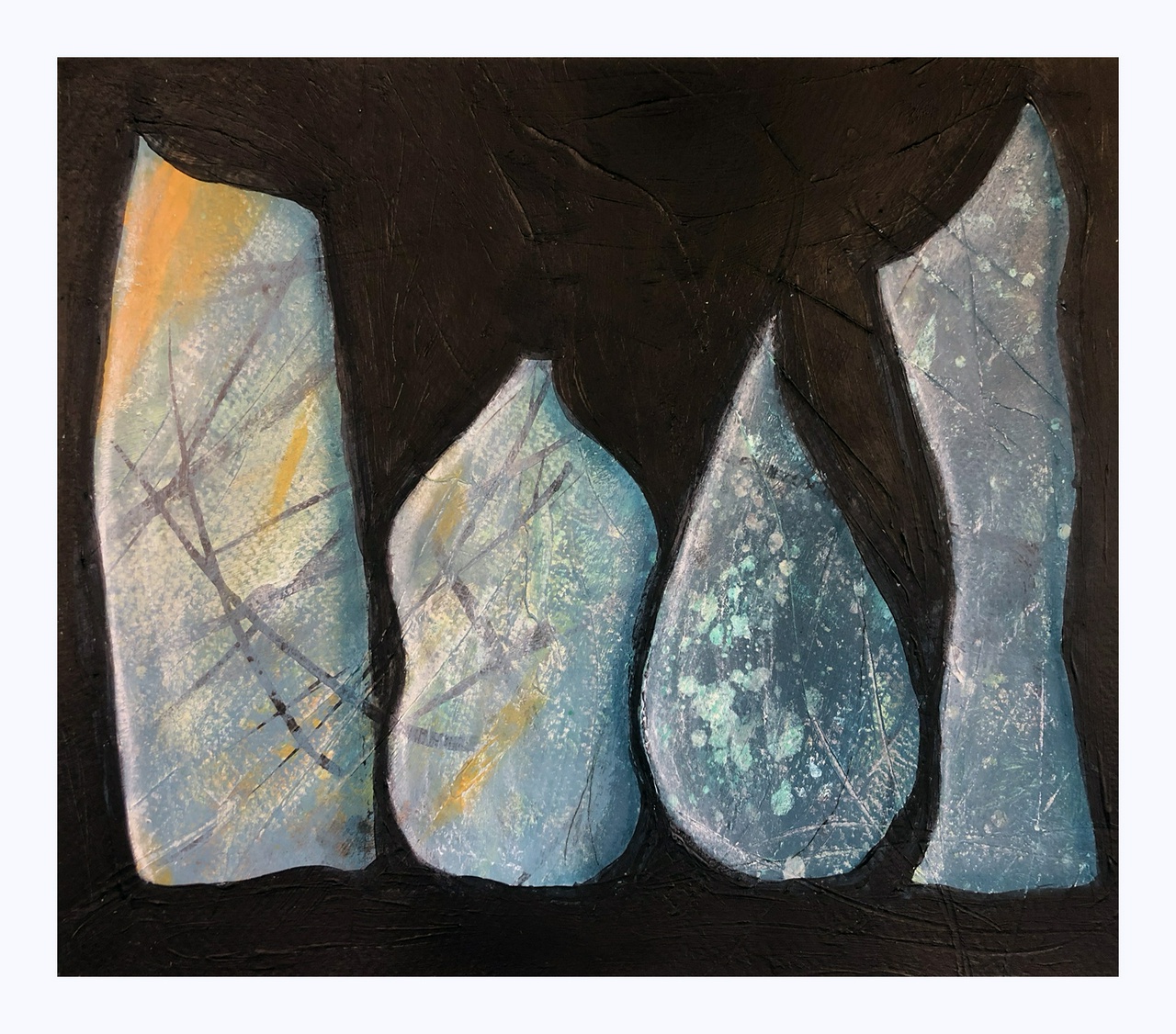 four textured blue figures stand upright, looking as though they might be bottles of blue chaos