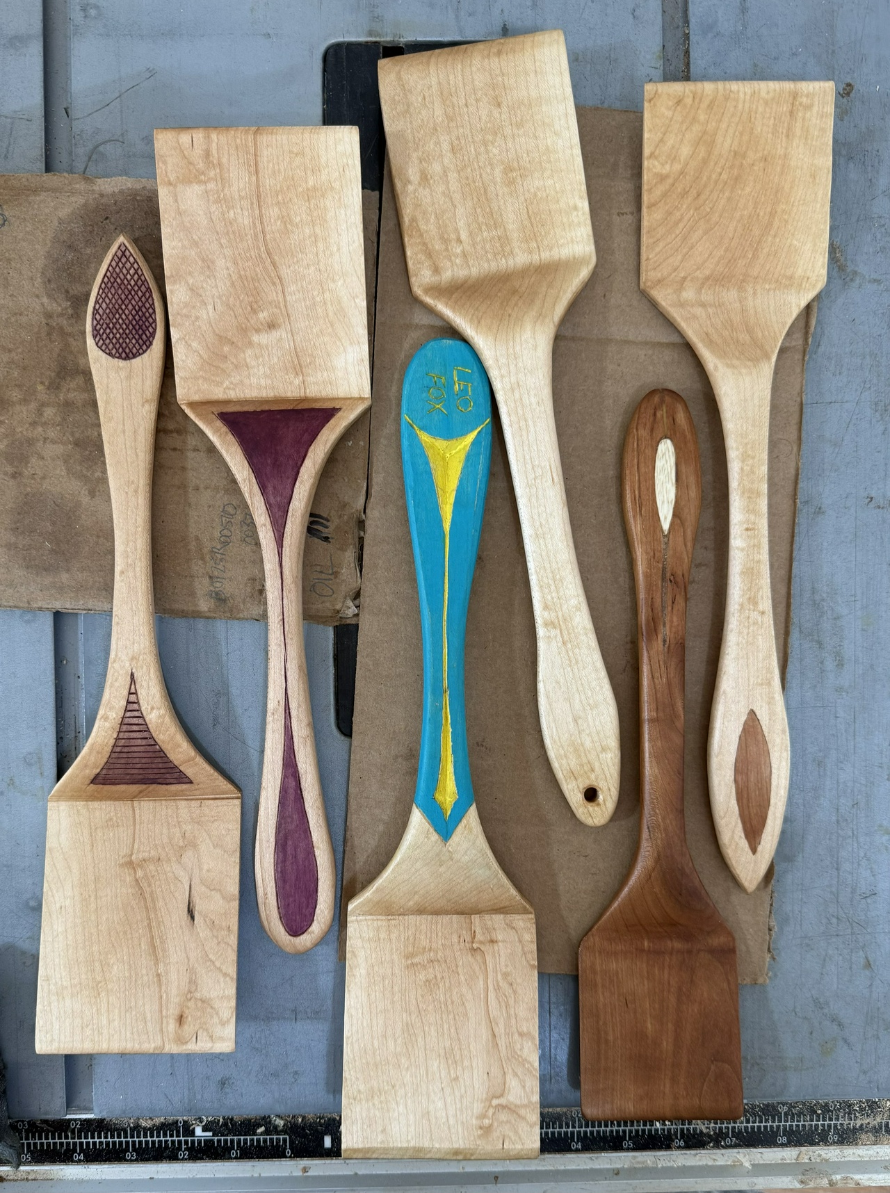 Six spatulas, with different decorative techniques.