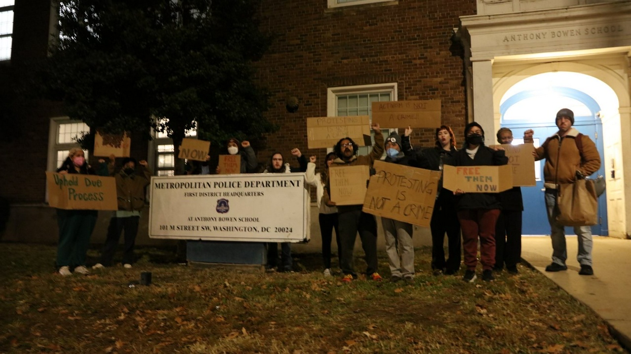 Community members gathered outside the DC First District Police Station to protest the wrongful arrests.