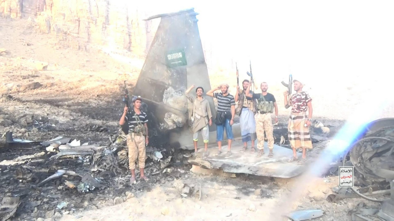 Ansarallah fighters on a downed Saudi jet. | Fight Back! News