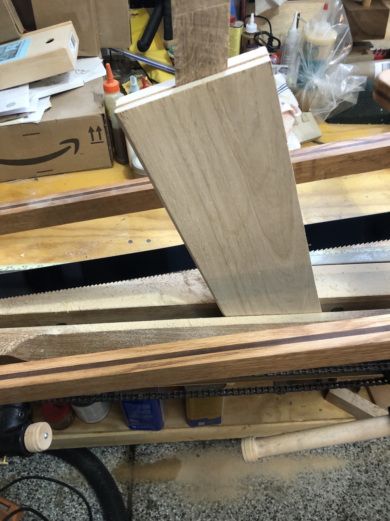 Using a wedge to hold the board open while resawing it