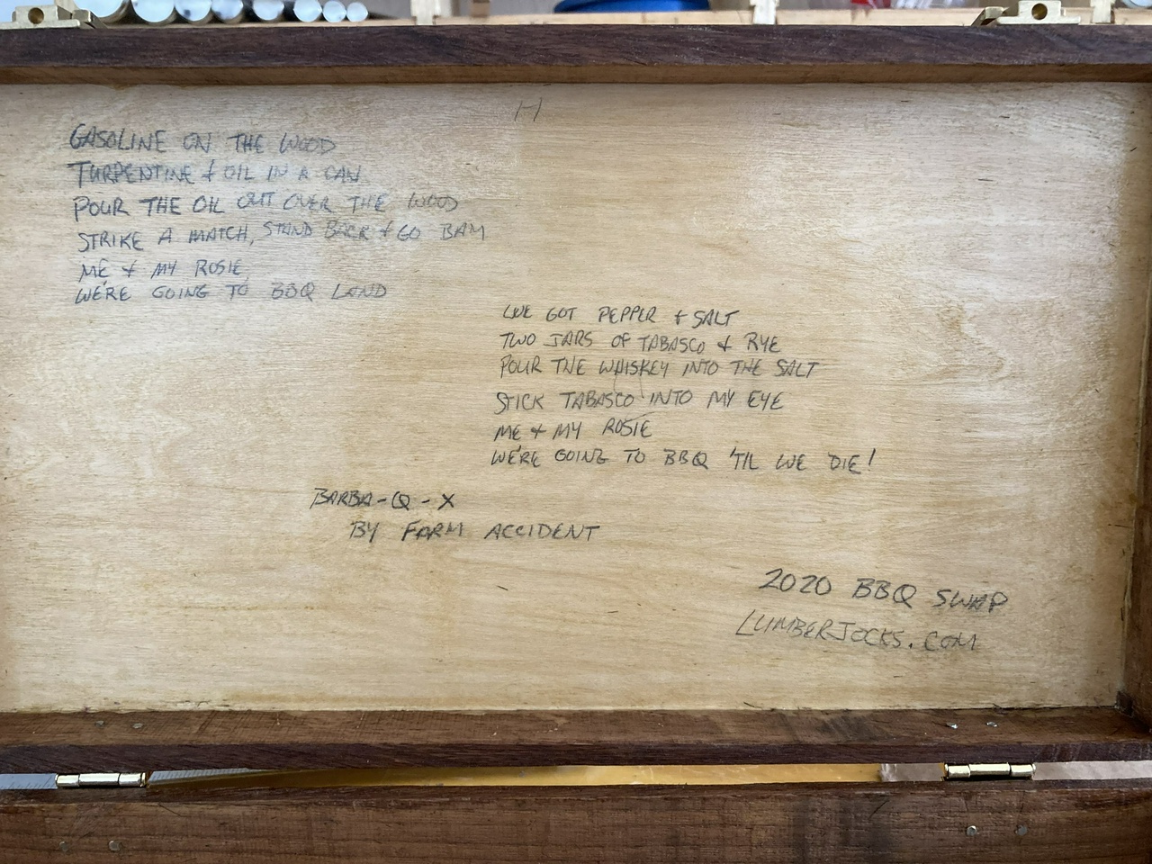 inside of the briefcase, showing the hand-written lyrics to Barba-Q-X by Farm Accident