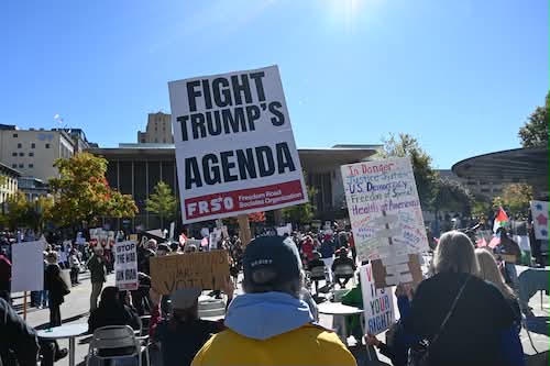 No Kings rally in Grand Rapids, Michigan. | Fight Back! News A group of protesters holding signs.